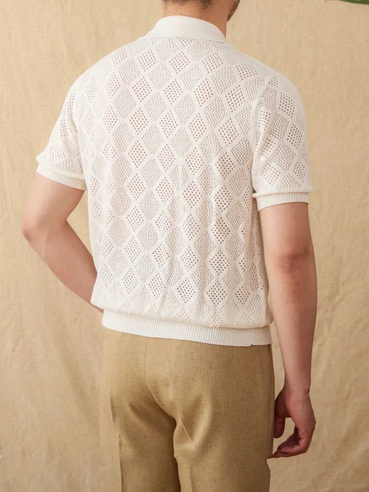 Light brown cotton short sleeve cardigan with zip front and lapel collar laid flat.