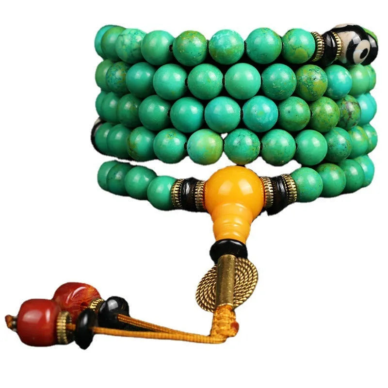 Natural turquoise bracelet with 108 round 8mm beads on wrist showing polished stone texture