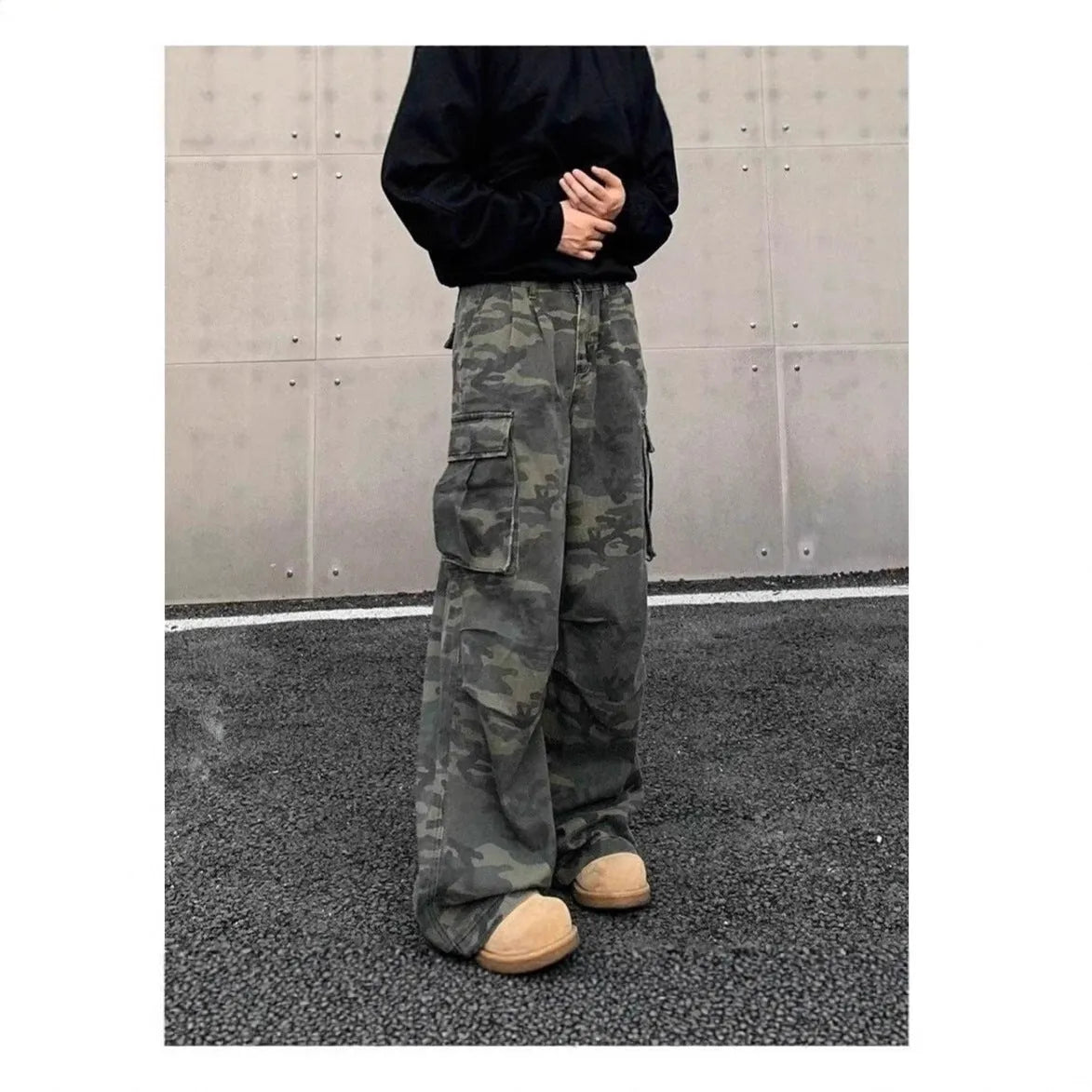 American vintage washed camouflage green cargo trousers with multiple pockets on a neutral background.