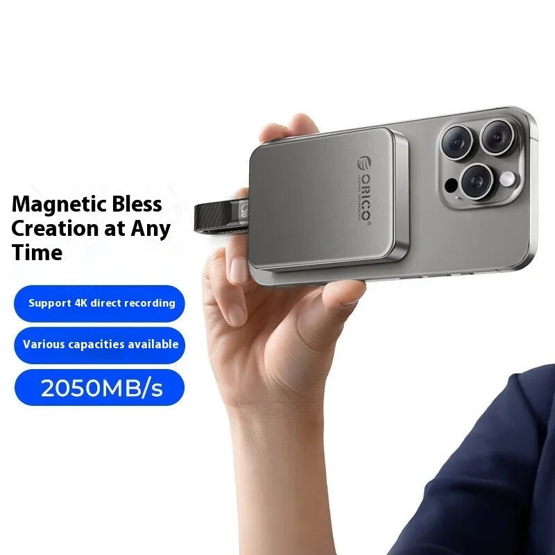 Grey magnetic mobile SSD with ultra-thin design and magnetic suction ring for portable storage expansion