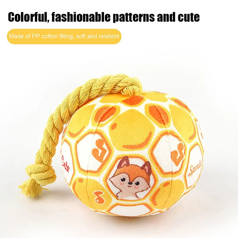 Bright coloured elastic football dog toy with cotton rope construction for tug of war and teeth grinding