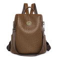 Women's black anti-theft backpack with waterproof PU construction showing organisational pockets and stitching details