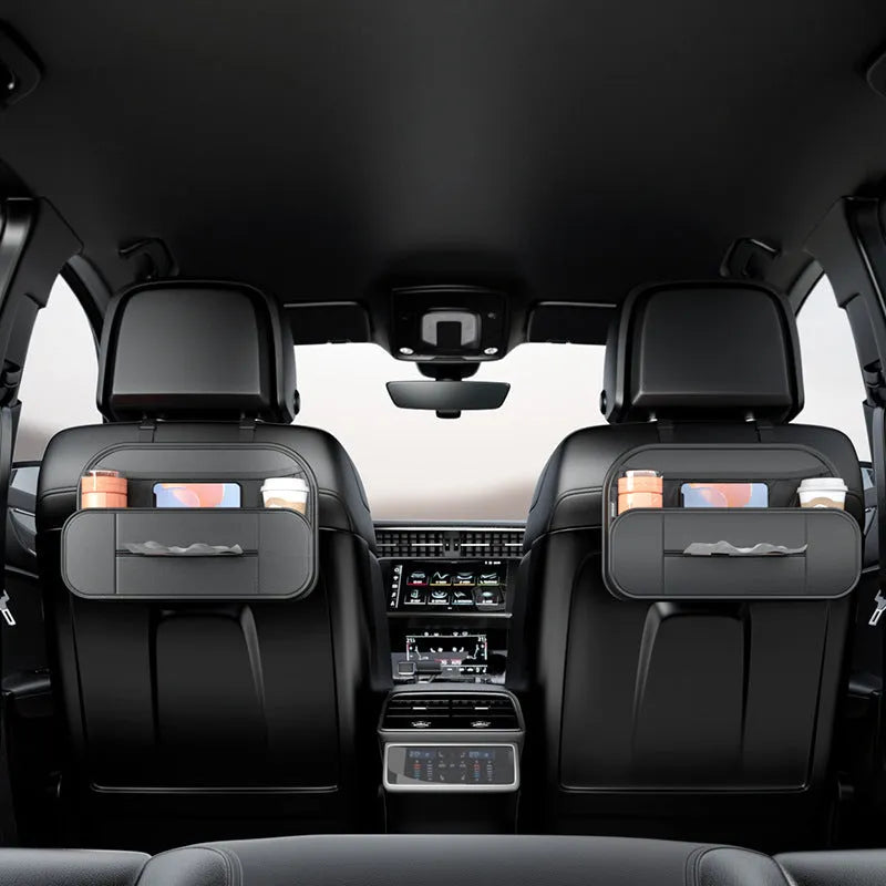 Black leather car seat rear storage bag measuring 36x24x8cm hanging on a vehicle seat back