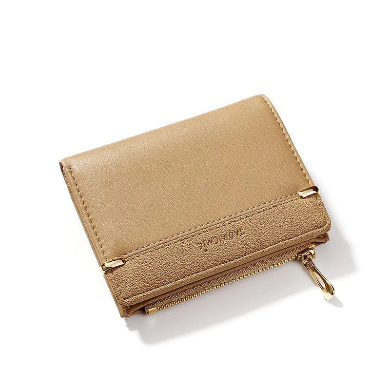 Short zipper ladies wallet in PU leather showing internal card slots, bill holder and change compartment.