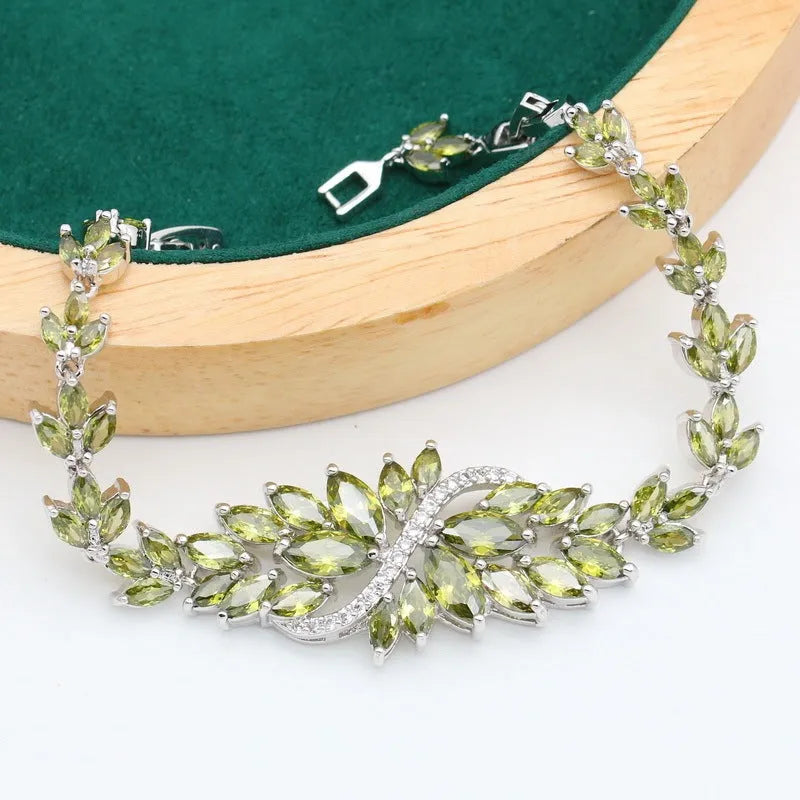 Complete retro jewellery set with floral pattern showing necklace, bracelet, earrings, and ring in olive, purple, or colourful finishes