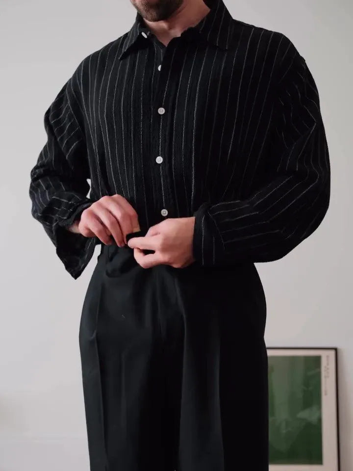 Black pinstriped button-down shirt with regular fit on a hanger
