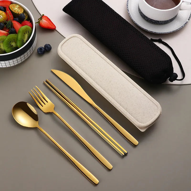 Four-piece stainless steel cutlery set with knife, fork, spoon and teaspoon in a mesh bag, gold and silver colour options
