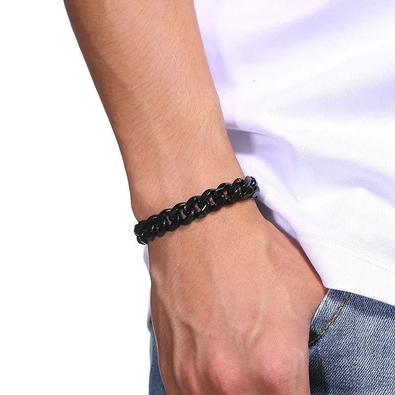Gold six-sided geometric Cuban link metal bracelet on wrist, showing textured chain design.