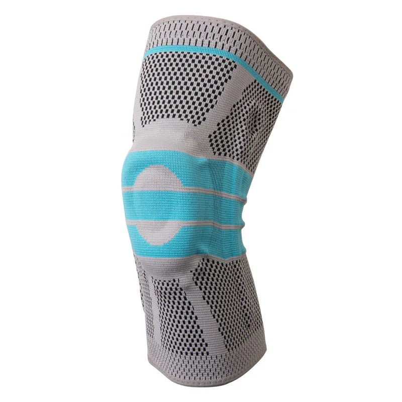 Sky blue elastic fibre knee pad for sports, shown in size L on a knee.