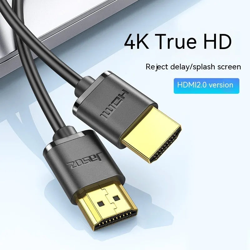 A thin, flexible HDMI cable with gold-plated connectors on a white background.