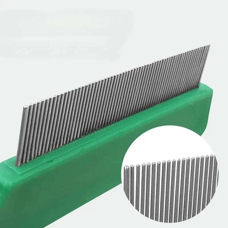 Green plastic-handled flea comb with stainless steel pins for dog and cat grooming.