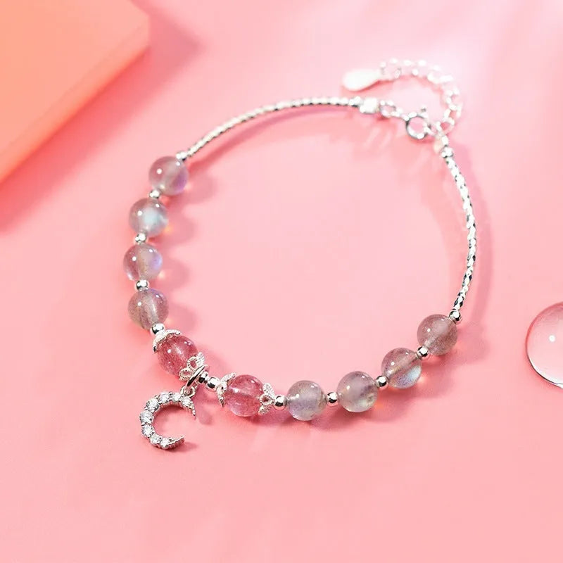 Moonstone handmade bracelet with crescent moon charm and adjustable extension chain.
