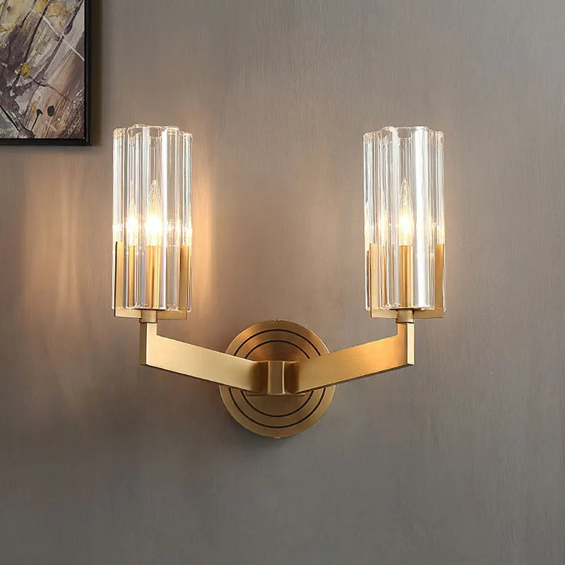 Modern minimalist copper wall lamp with single head design mounted on a wall.