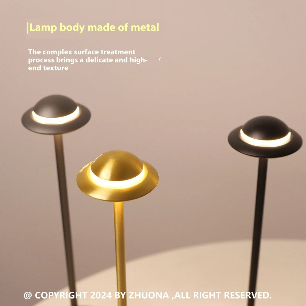 UFO-shaped metal table lamp with touch controls in black, gold or grey colour options