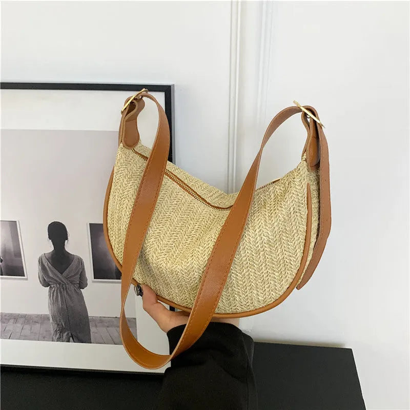 Women's straw woven crossbody bag showing woven texture and internal organisation with phone pocket
