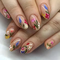 Almond-shaped removable nail art with floral patterns including roses and tulips