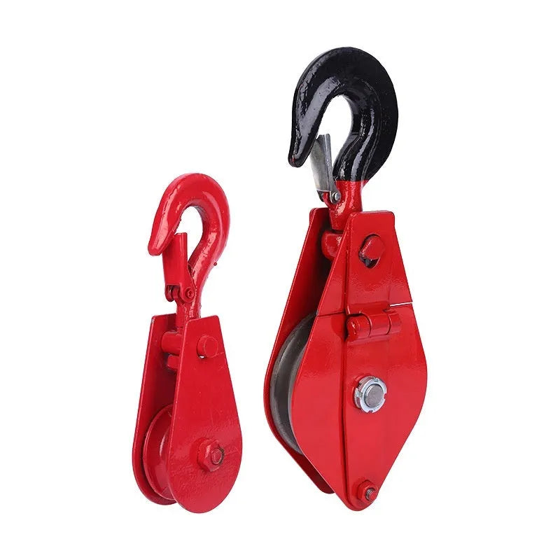Red industrial lifting pulley with a forged steel hook and safety latch.