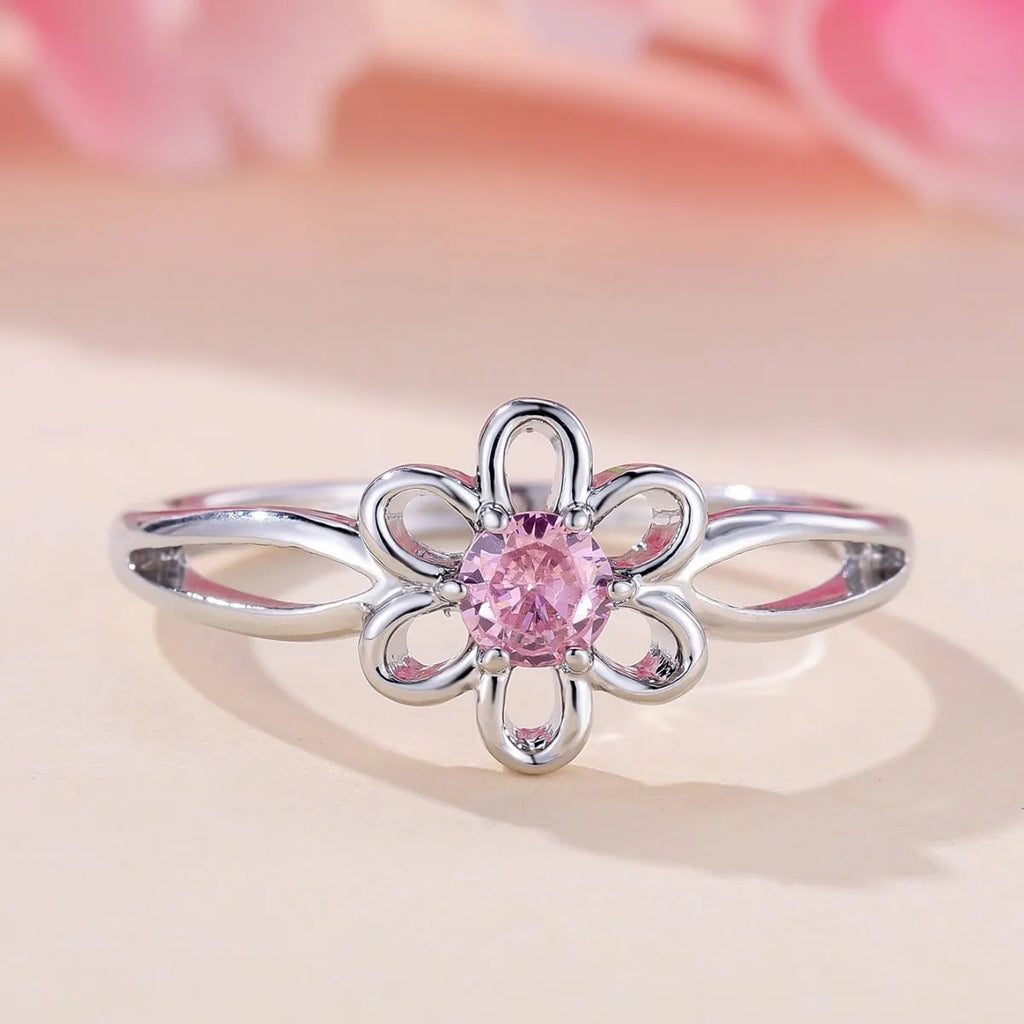 Women's fashion ring with hollowed flower pattern in electroplated copper, platinum pink diamond colour