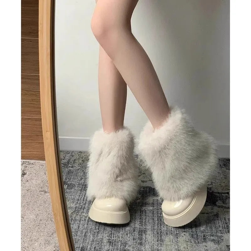 Women's black fleece-lined low-top winter snow boots with a round toe and a waterproof rubber platform sole.