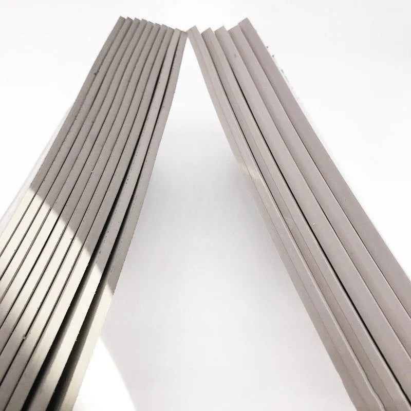 Black and grey plastic photosensitive pad for seal making, 330mm by 110mm.