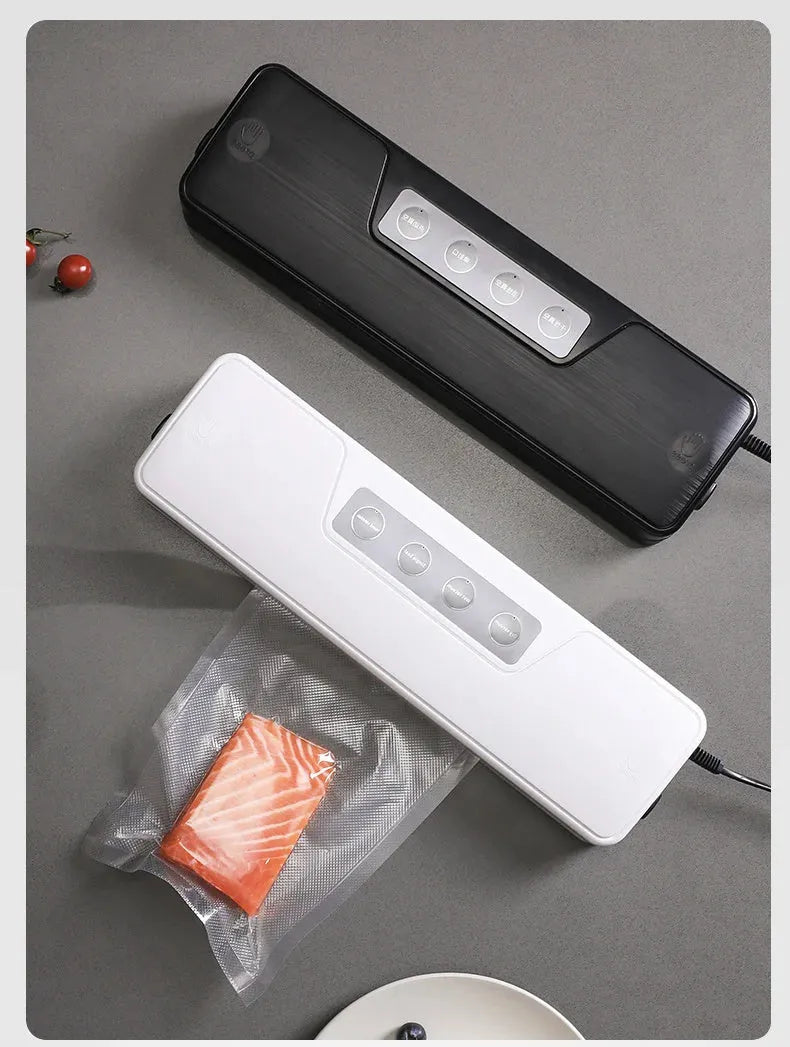 White automatic vacuum sealer machine on a kitchen countertop.
