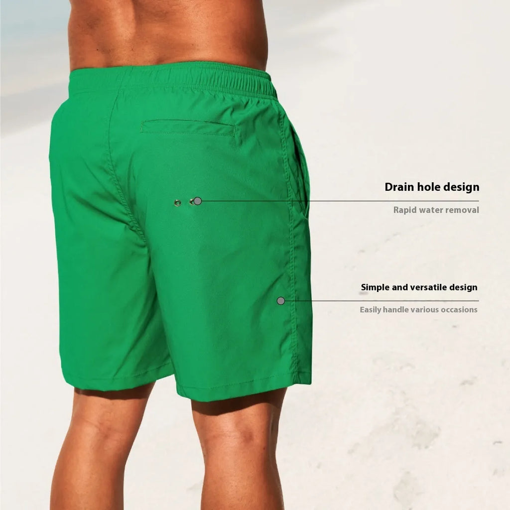 Men's solid colour quick-drying nylon beach shorts on a hanger, showing straight leg opening.