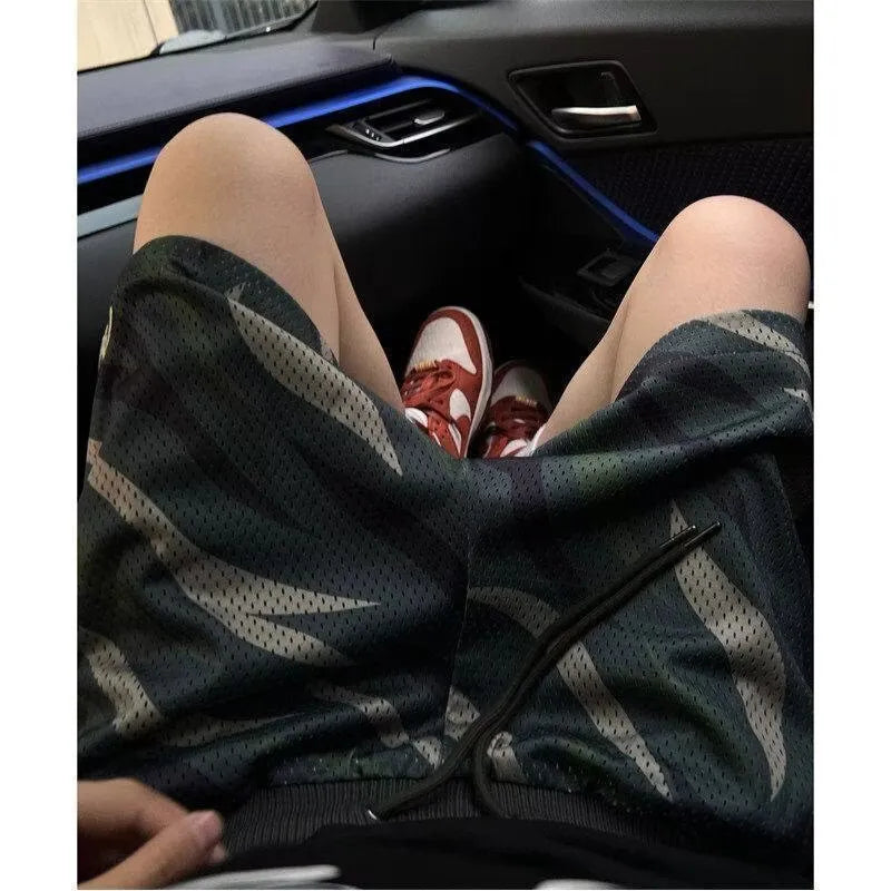 Men's straight-leg camouflage mesh shorts in cotton blend fabric on a white background