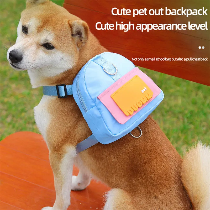 Blue adjustable dog backpack harness with storage compartments and a tow rope attached.