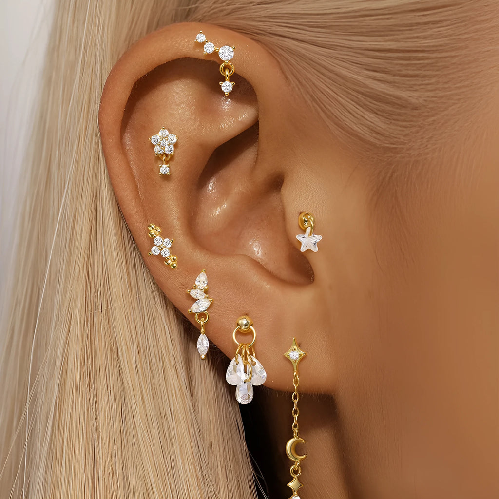 S925 sterling silver geometric moon and star earrings with diamond detail in a gold colour.