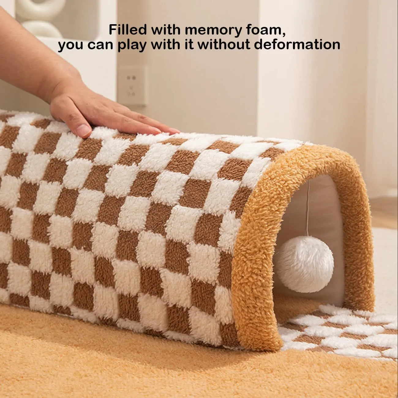 A plush fan-shaped dog and cat bed with an integrated tunnel, shown in a yellow plaid design.