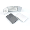 Black tri-fold Bluetooth keyboard shown in folded position demonstrating compact 30.2cm size