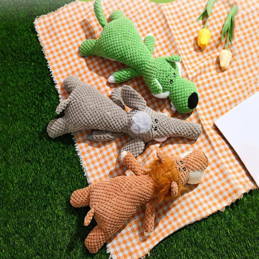 Animal-shaped plush dog toy with corn kernel texture for teeth cleaning and built-in sound device