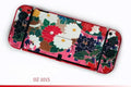 Clear Nintendo Switch OLED hard protective case with cartoon pattern design showing analogue stick caps.