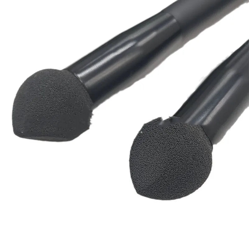 Black sponge tip concealer brush with wooden handle for makeup application.