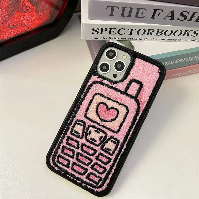 Pink TPU iPhone case with a raised towel embroidery texture on the back.