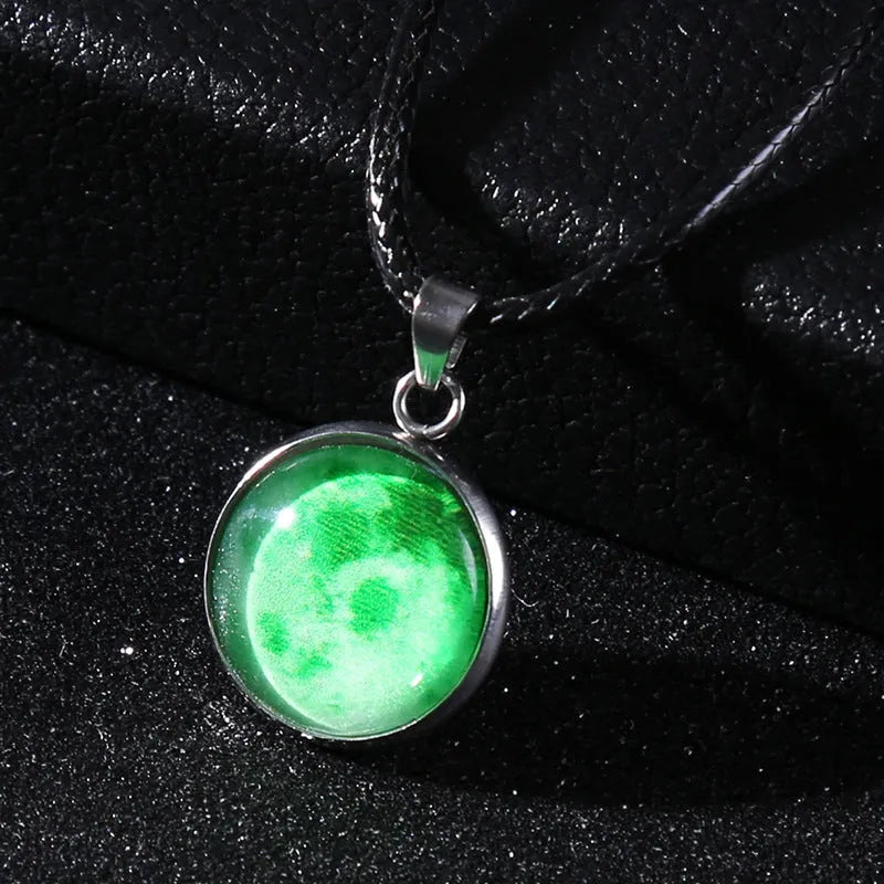 Luminous moon and constellation pendant necklace on a chain with an extension, shown in one of ten possible colours.
