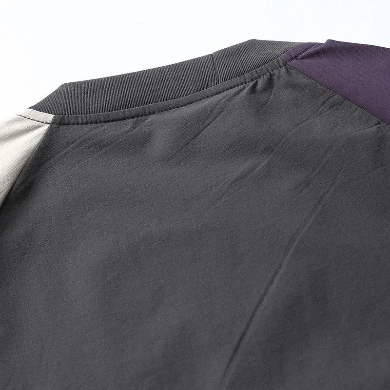 Dark grey men's loose fit t-shirt with light coloured contrast raglan sleeves.