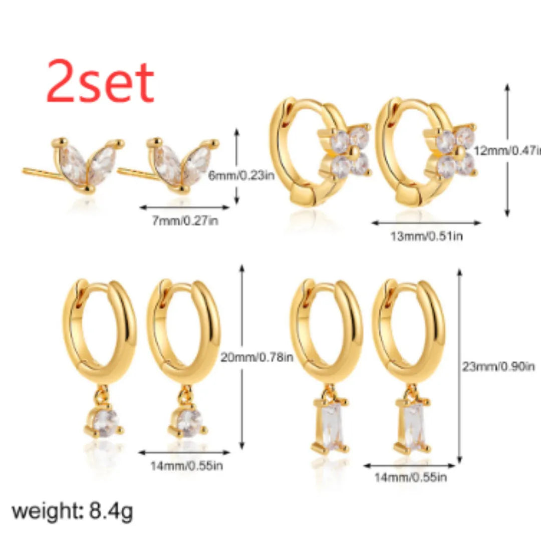 Geometric copper earrings with electroplated gold finish featuring star shapes and zircon detailing