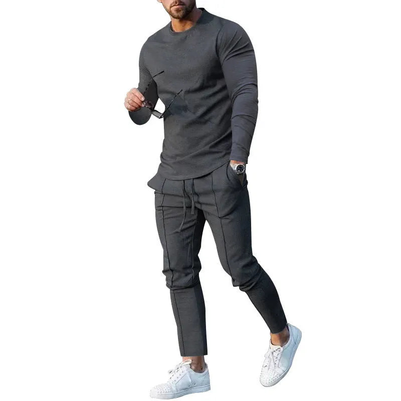 Men's light grey polyester two-piece suit with long sleeve round-neck t-shirt and matching trousers