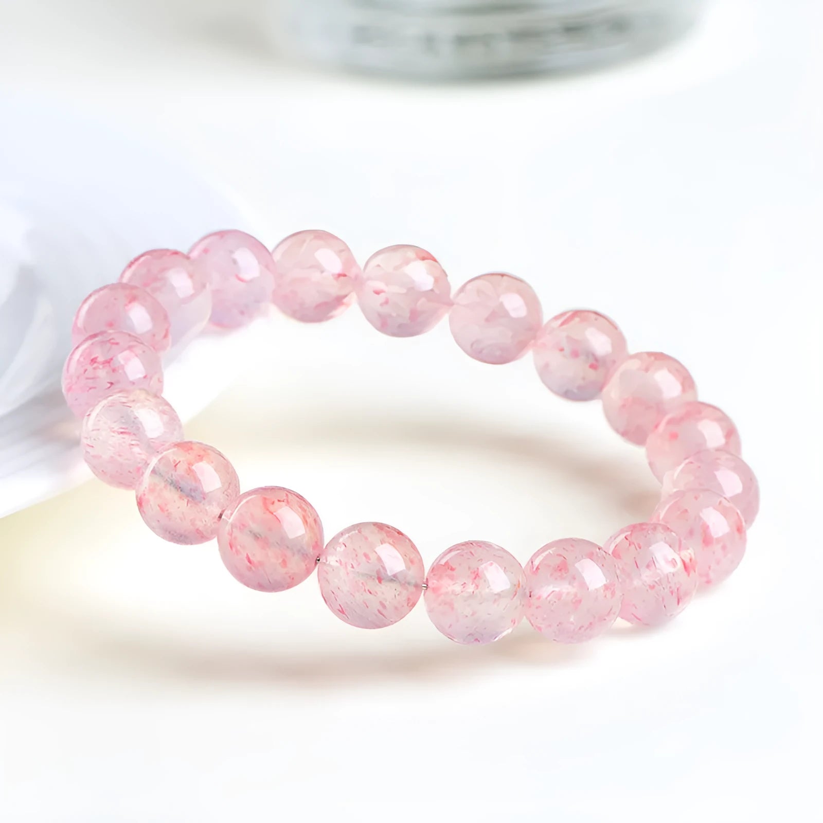 Natural white water strawberry quartz crystal ball bracelet with 19 polished 10-10.8mm beads.