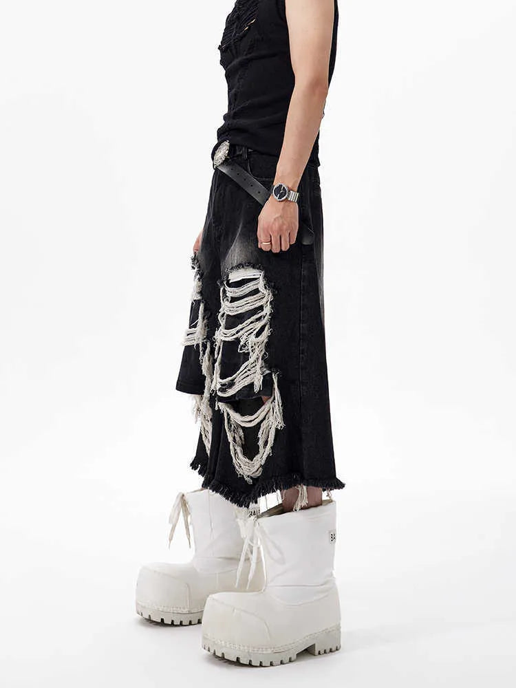Black cropped wide-leg women's jeans with ripped patch details and mid-high waist