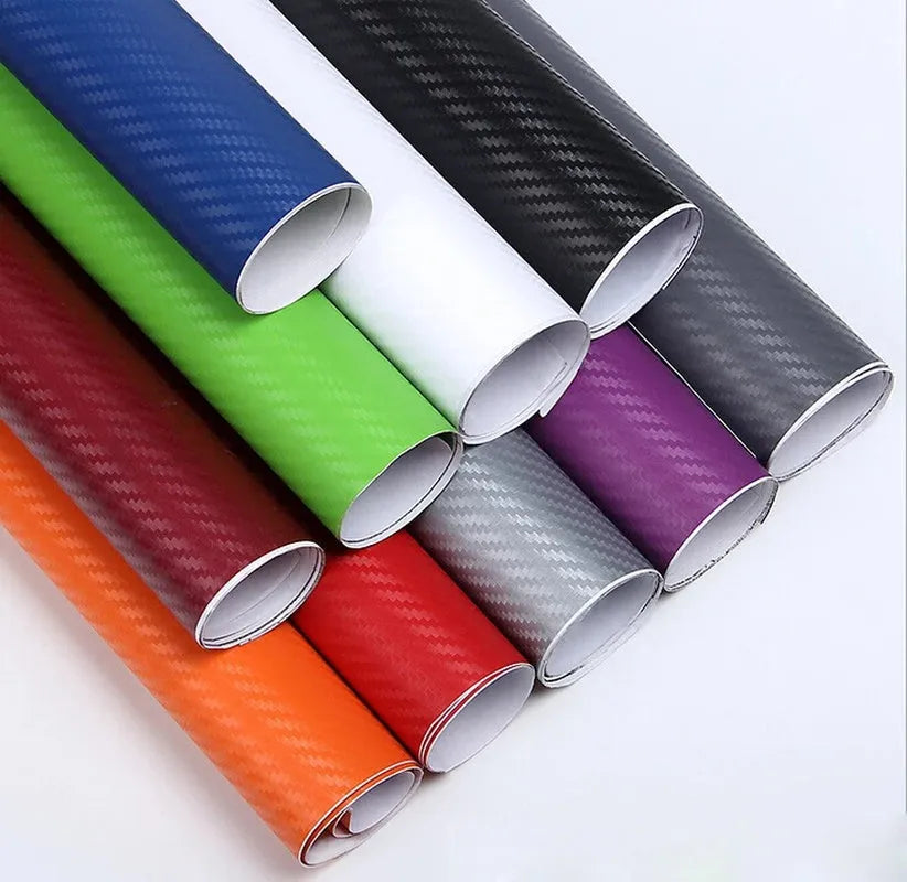 Roll of black 3D carbon fibre texture adhesive sticker for car decoration, showing textured pattern.