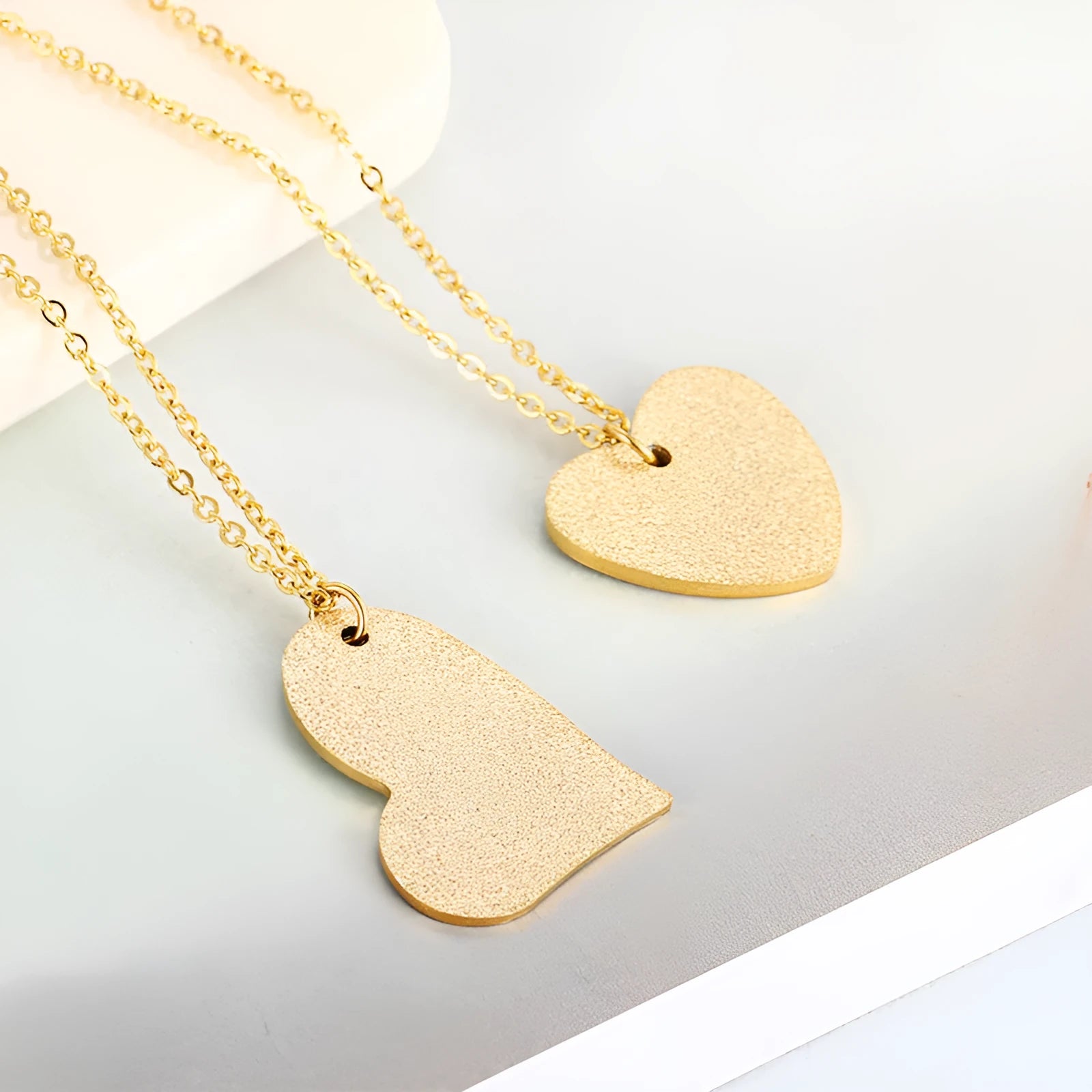 Geometric heart-shaped titanium steel pendant necklace on model, simple fashion style
