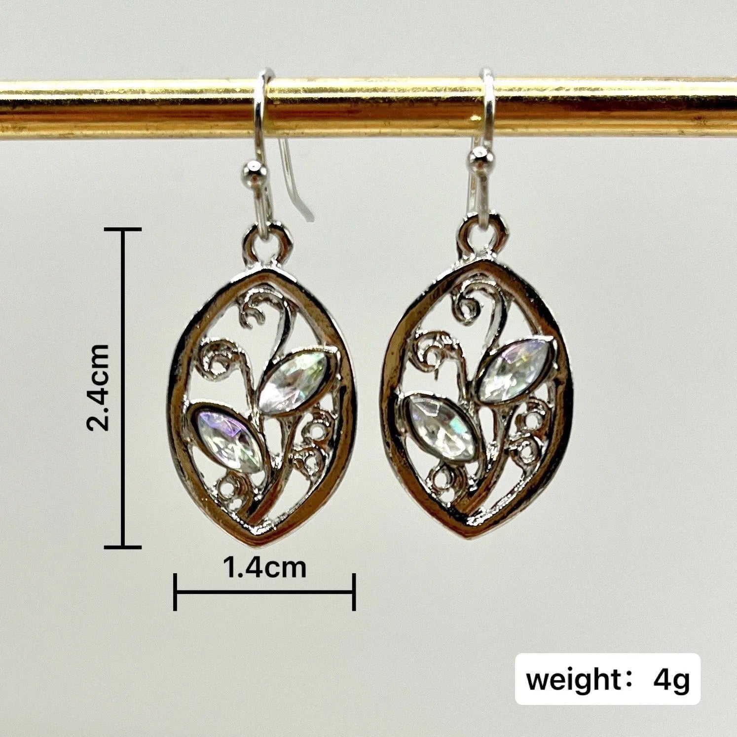Women's silver alloy earrings with leaf designs and embedded colourful moonstones