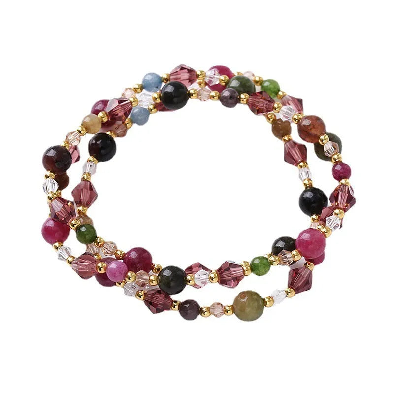 Women's adjustable crystal bracelet with tourmaline, strawberry quartz and amethyst beads on three-ring design