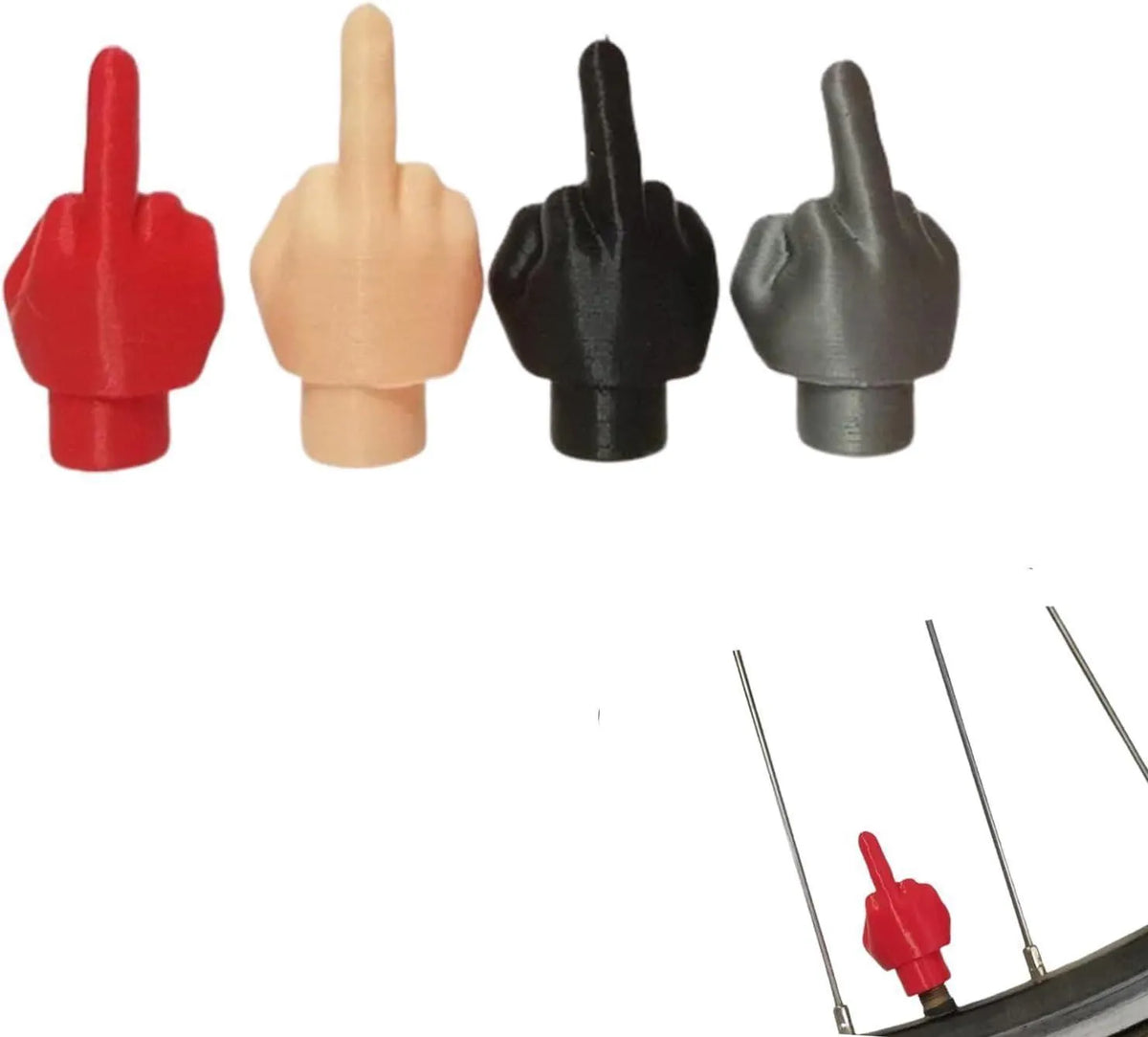 Four latex car tyre valve dust caps, two black and two skin colour, arranged together.