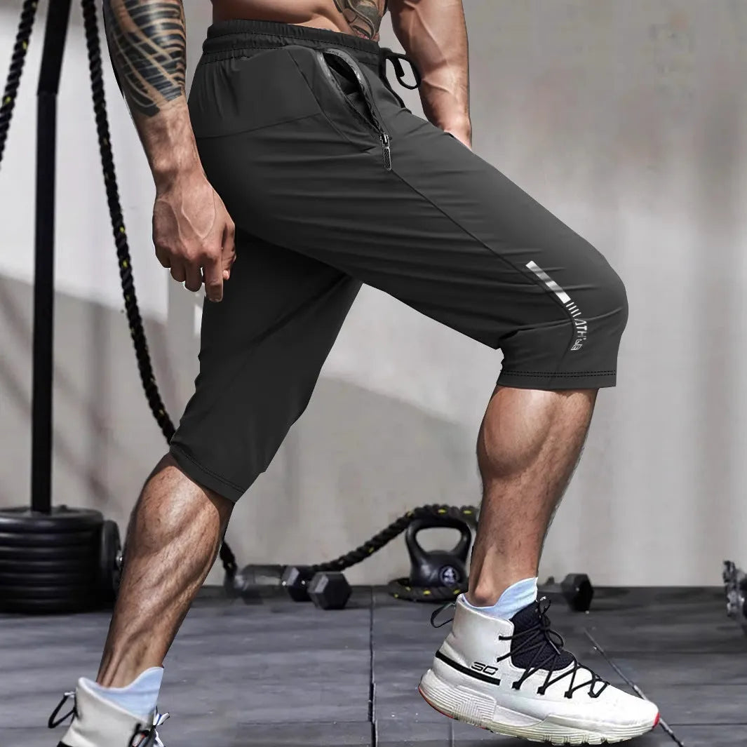Men's cropped ice silk sports casual pants in nylon, shown in black, grey, khaki, or blue.
