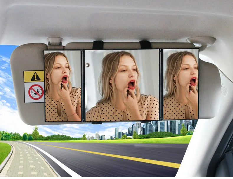 Silver car folding makeup mirror shown both closed at 15.5cm and open at 30.5cm wide.