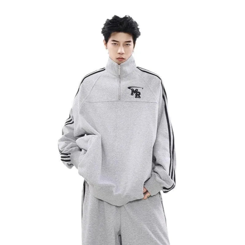 Black Hong Kong style retro sports hoodie with stand collar, shown on a model.