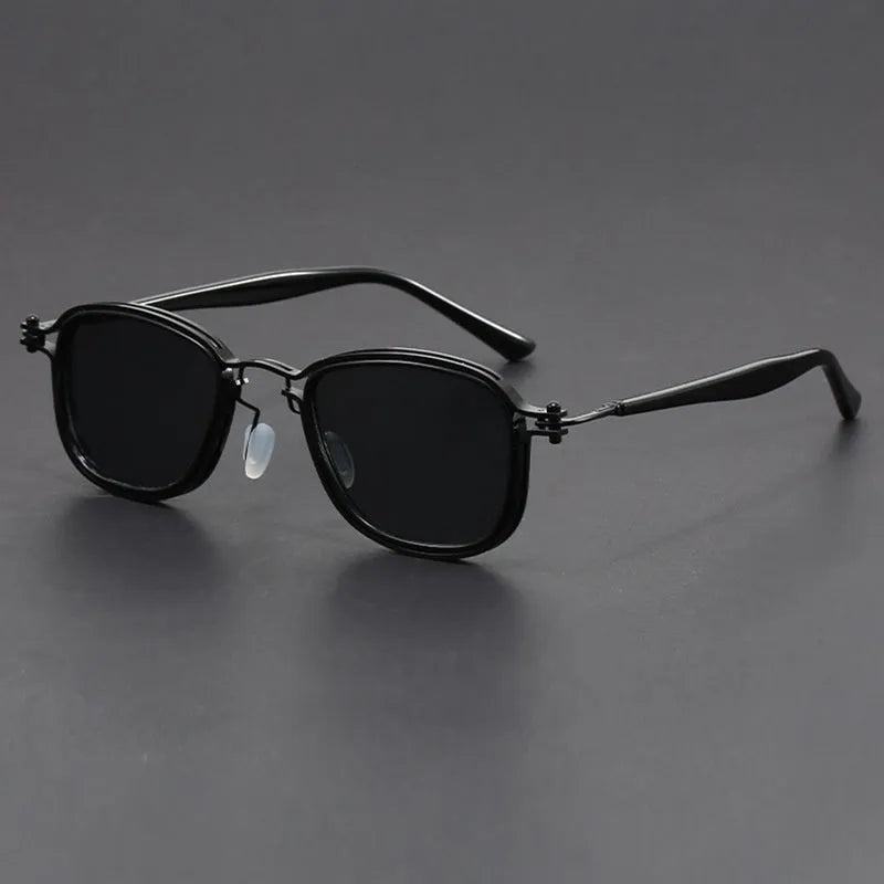 Retro square frame sunglasses with AC lenses in a black gold and grey colour combination.